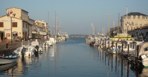 Pretty, car free, Marseillan Port lined with boats and restaurants